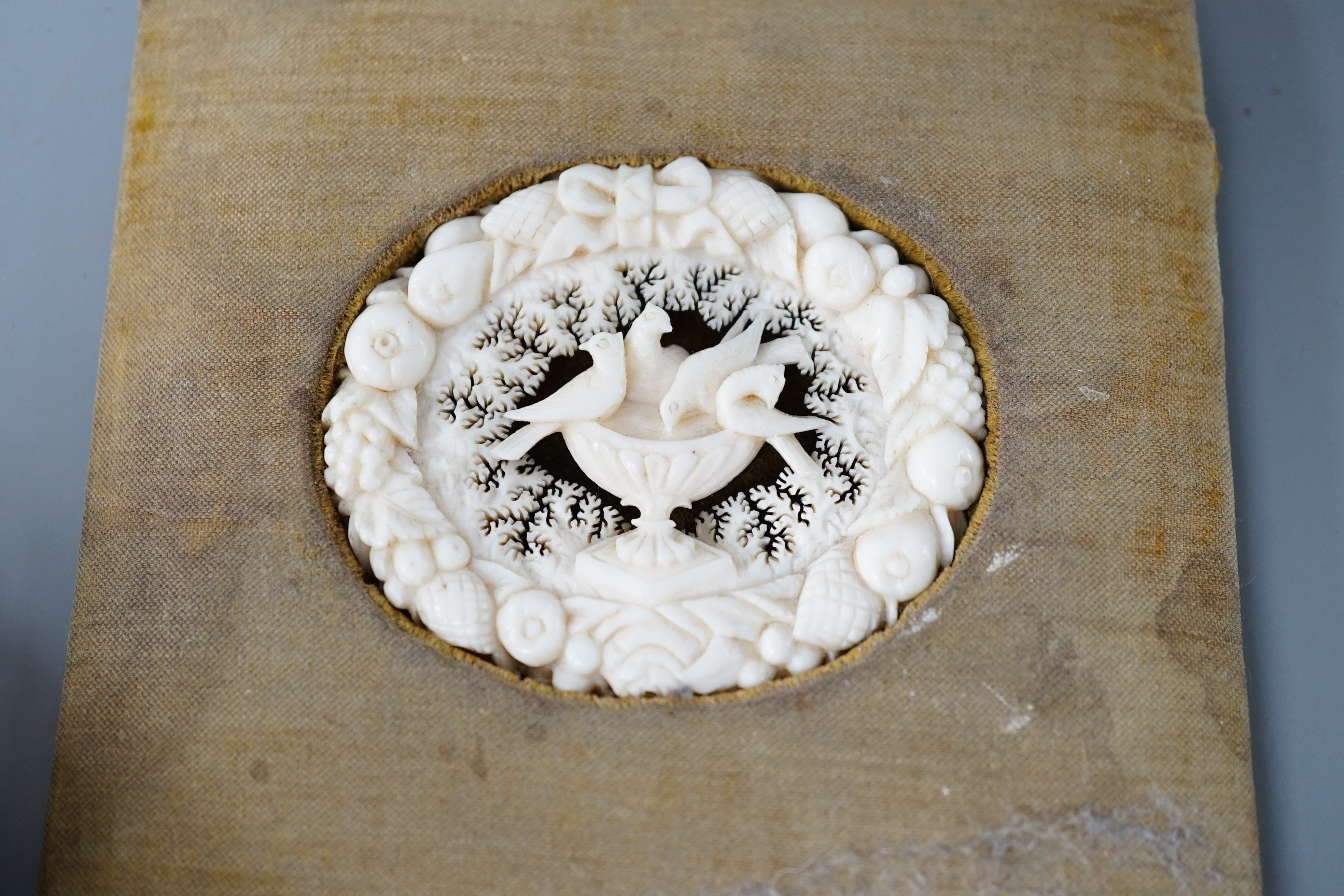 A 19th century Chinese pierced Ivory scent box together with a netsuke modelled as a horse and ivory pierced panel (3)